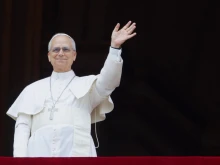 Pope Leo XIV waves to the crowd gathered on St. Peter’ s Square for the Regina Coeli on Sunday, May 11, 2025.