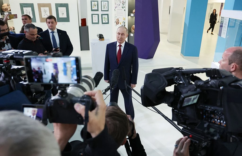 In this pool photograph distributed by the Russian state agency Sputnik, Russian President Vladimir Putin (center) speaks to journalists at the Sirius Educational Center in Sochi on May 19, 2025, after a telephone conversation with U.S. President Donald Trump.?w=200&h=150